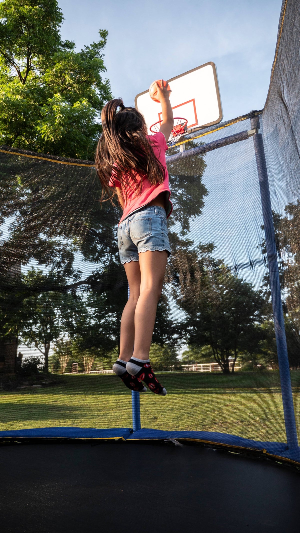 Jumpking Oval 10' x 15' Trampoline, with Two Basketball Hoops, Blue/Yellow
