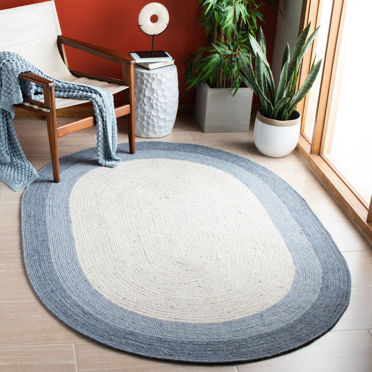 SAFAVIEH Braided Nazca Solid Bordered Area Rug, Ivory/Blue, 4' x 6' Oval